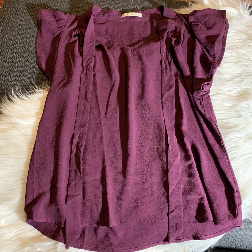 Purple blouse with tied bow collar